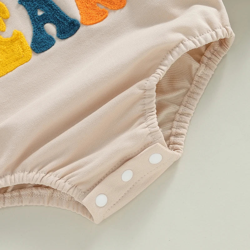 Baby girls and boys beige long sleeve bodysuit with letter embroidery, casual playsuit by August + Willow for 12-18 months.
