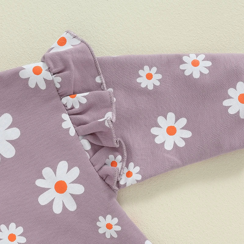 Baby girl bubble romper with daisy flower print, long sleeves, round neck, by August + Willow, perfect for infants 6-12 months.
