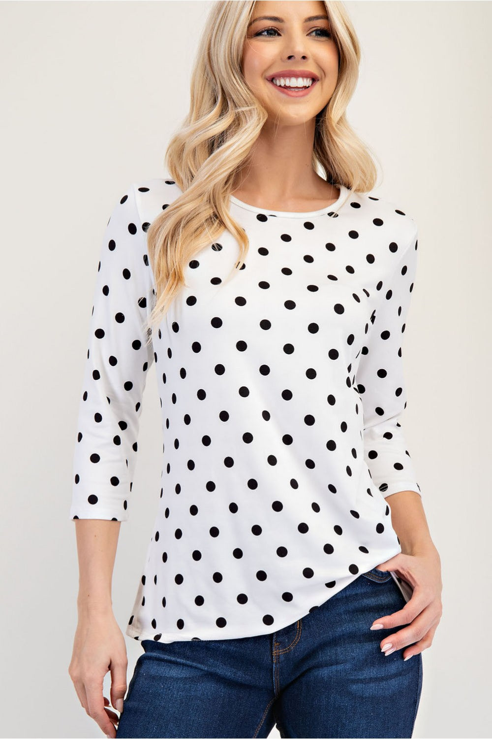 Black polka dot layering top by Celeste with 3/4 sleeves, stylish and comfortable for Missy regular sizes.