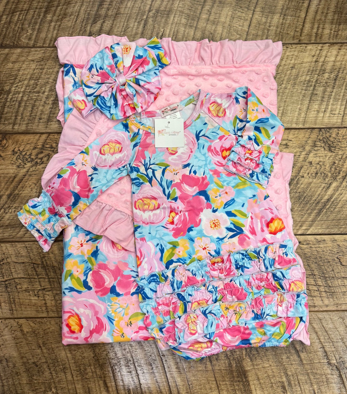 Clover Cottage newborn gift set with pink gown, matching headwear, and soft blanket for baby girls.