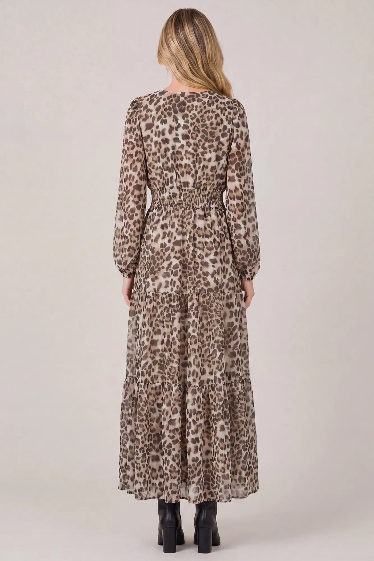 She and Sky long sleeve animal print tiered maxi dress with pockets, featuring a flowing silhouette and stylish pattern.