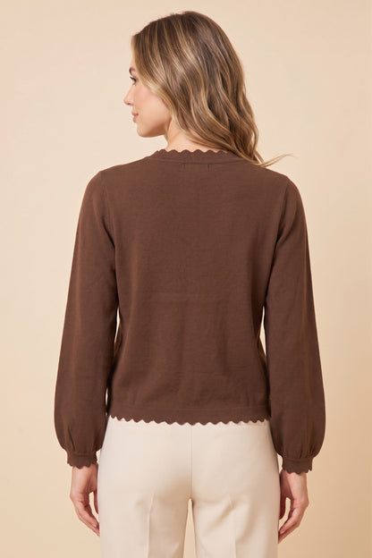 ModestAndDevoted ballon sleeve scallop edge cardigan sweater with ribbed cuffs and hem, in soft knit fabric.