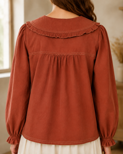 Listicle contrast stitch Peter Pan collar long sleeve blouse in terracotta, featuring a stylish and feminine top with detailed stitching.
