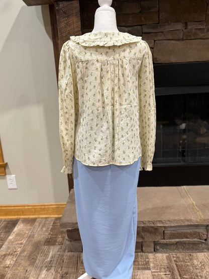 Long sleeve floral button-down blouse with Peter Pan collar by ModestAndDevoted, featuring a delicate ditsy floral pattern.