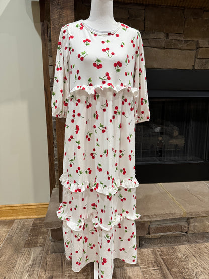 Cherry Delight Ruffle Tiered Maxi Dress by ModestAndDevoted, featuring ruffled tiers and flowy fabric in a vibrant cherry print.
