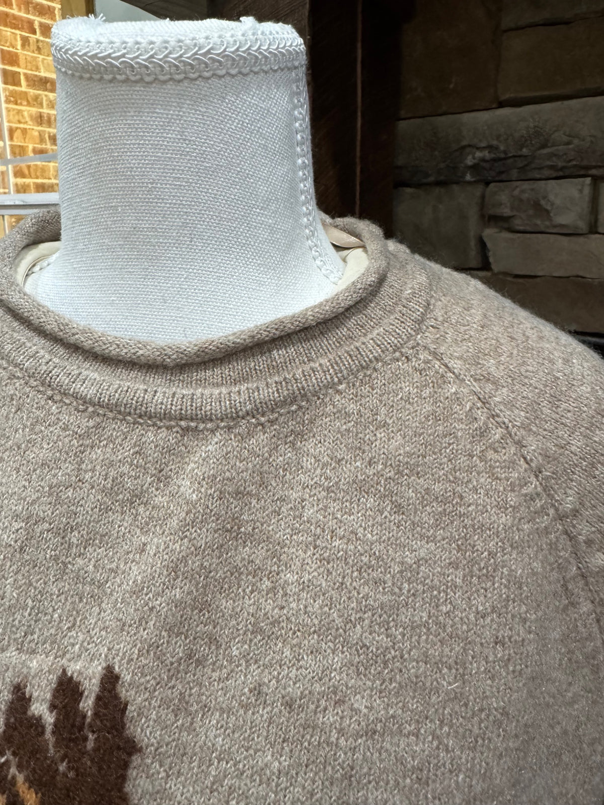 Closeup of rolled neckline and raglan shoulder