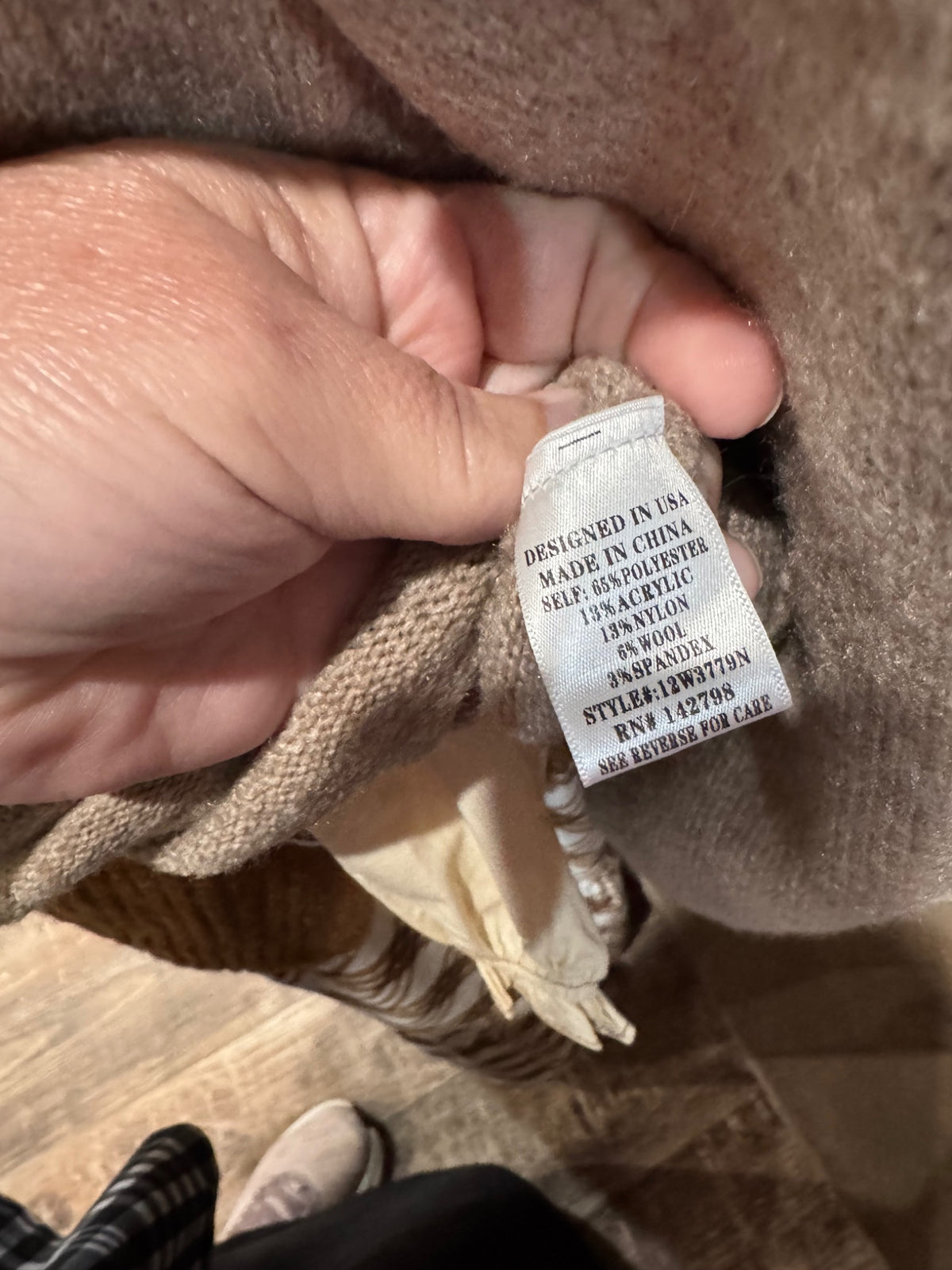 Back view of solid taupe mallard sweater