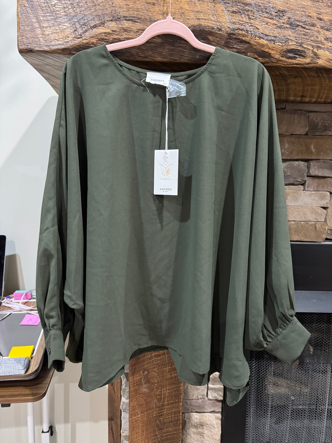 Andree dark olive blouse front view with rounded hem and balloon sleeves