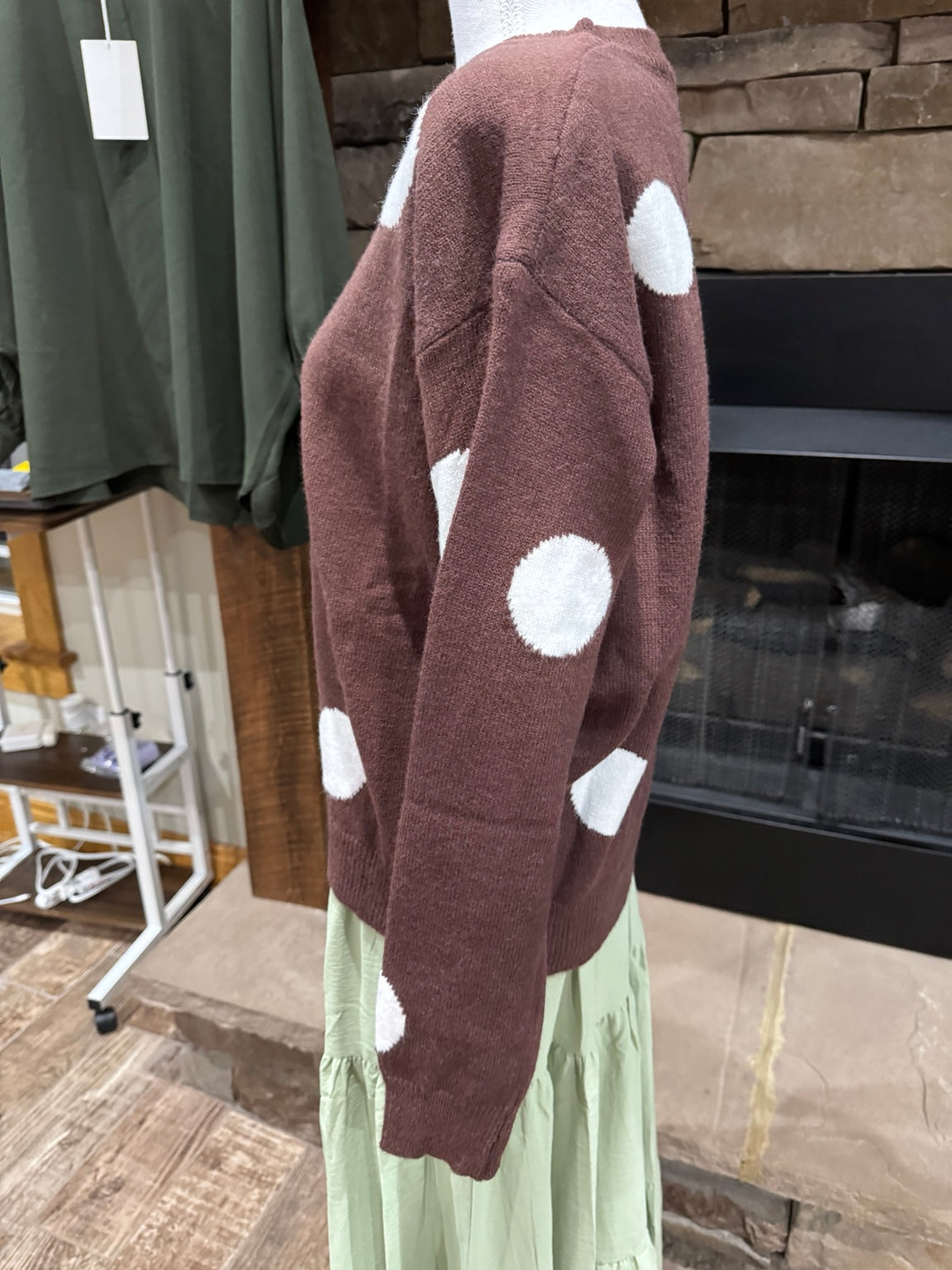 Side view of drop shoulder and long sleeve on Timing polka dot sweater
