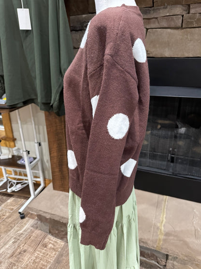 Side view of drop shoulder and long sleeve on Timing polka dot sweater