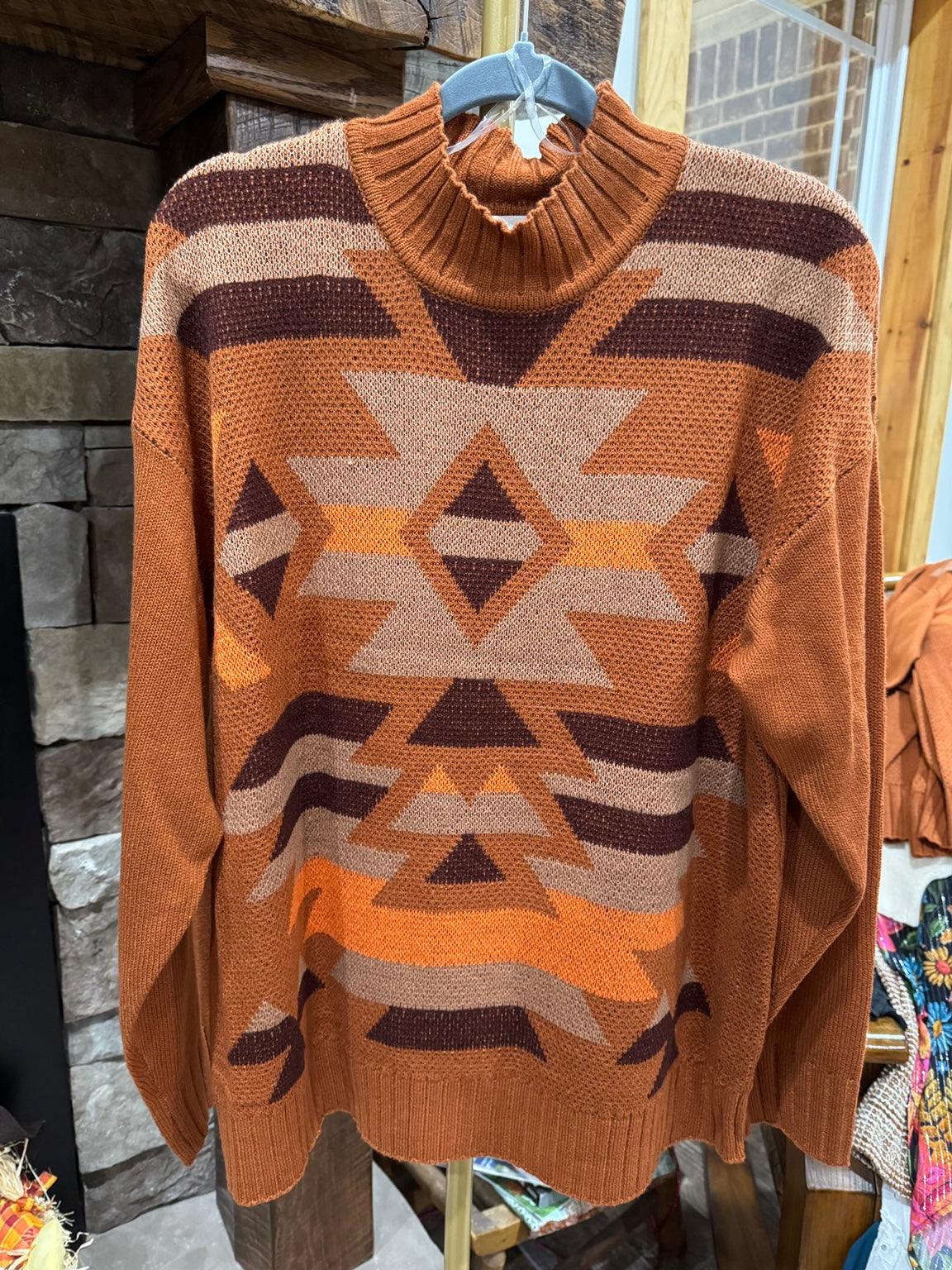 Rust geometric sweater front with mock neck
