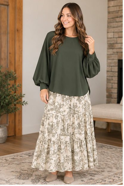 Andree olive balloon sleeve blouse paired with cream printed maxi skirt front