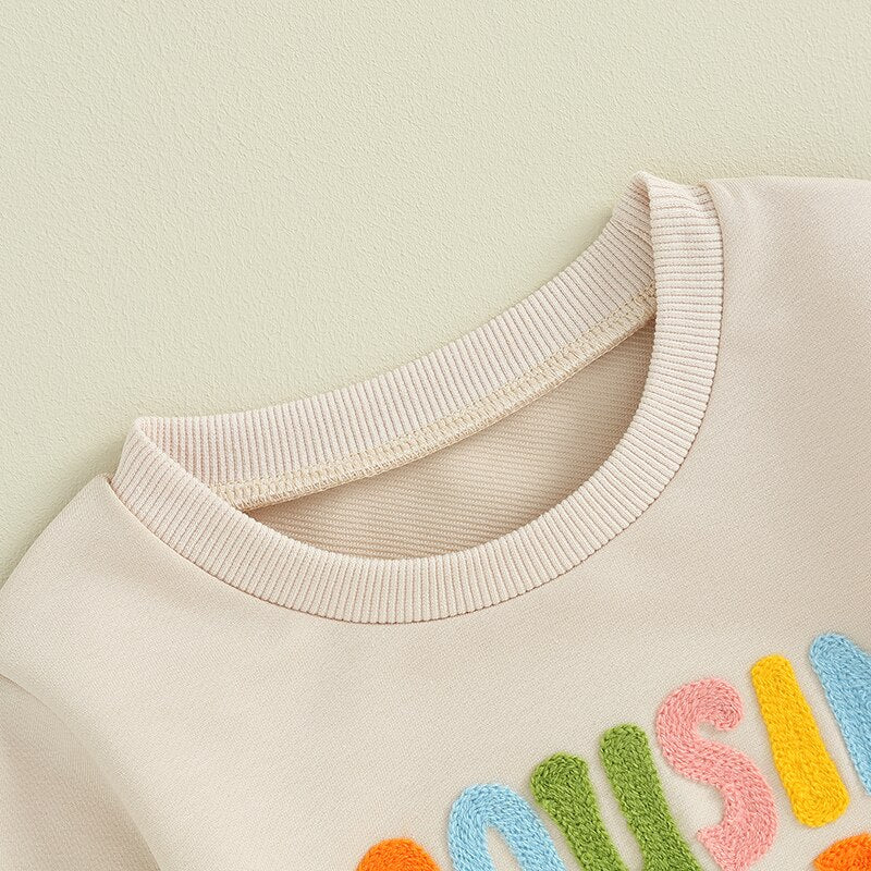 Cute toddler boys and girls fuzzy letter embroidery matching long sleeve crew neck pullover by August + Willow.