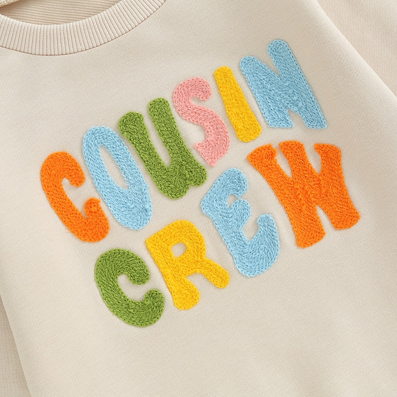 Baby and toddler fuzzy letter embroidered crew neck pullover by August + Willow, featuring long sleeves and cozy, loose fit.