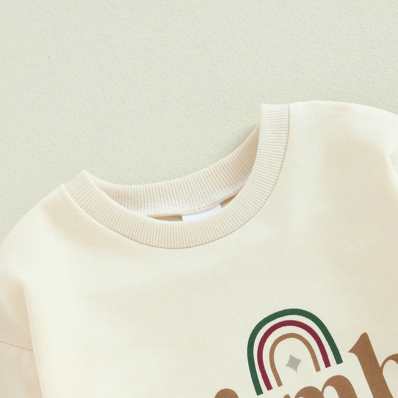 Baby boys and girls 2-piece womb makes bubble rompers by August + Willow, rainbow letter print long-sleeve bodysuits for twins.