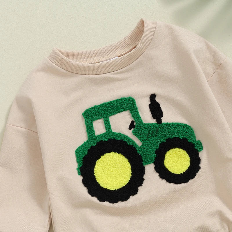 Baby girls and boys autumn romper by August + Willow, long sleeve crewneck with tractor embroidery, casual beige playsuit for infants.