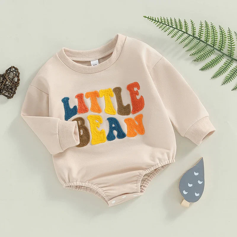 Baby girls and boys beige long sleeve Little Bean bodysuit by August + Willow with letter embroidery, casual romper for 12-18 months.