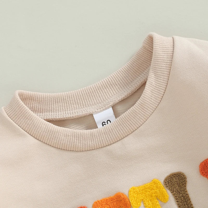 Baby girl and boy long sleeve bodysuit by August + Willow featuring letter embroidery, casual playsuit for infants aged 12-18 months.