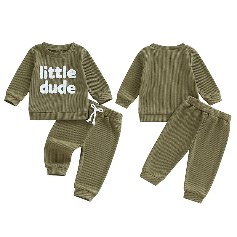 Baby toddler boys beige 2-piece outfit with letter embroidery long sleeve top and elastic waist solid pants by August + Willow.