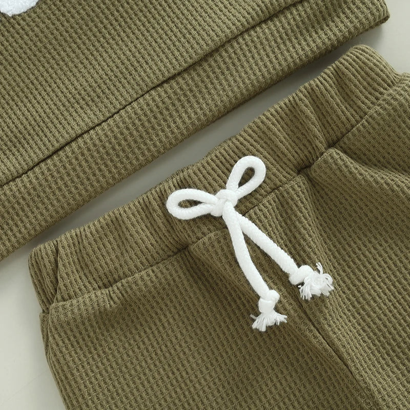 Baby toddler boys 2-piece waffle outfit by August + Willow with embroidered letter long sleeve top and elastic waist solid pants.