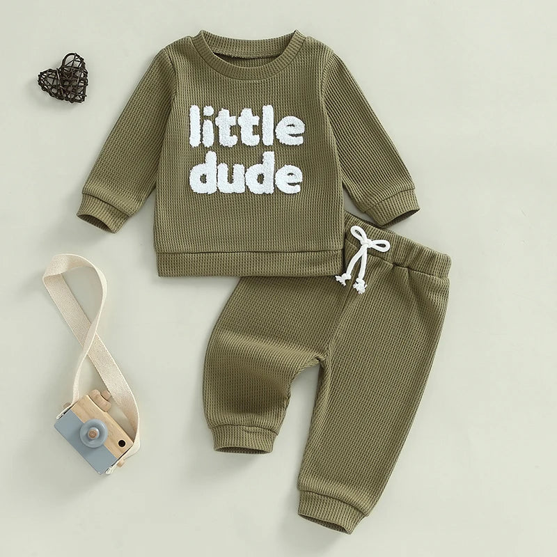 Baby toddler boys 2-piece waffle outfit with embroidered letter long sleeve top and elastic waist solid pants, beige, by August + Willow.