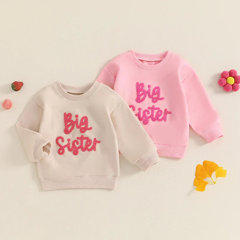 Toddler girls beige long sleeve crewneck pullover top with letter embroidery from August + Willow, loose fit for baby and toddler outfits.