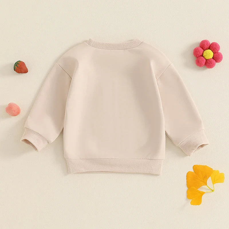 Toddler girls beige long sleeve crewneck pullover top with letter embroidery, loose fit, from August + Willow baby and toddler outfits.