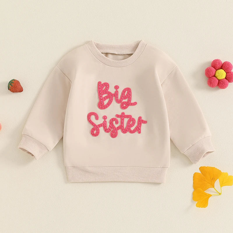 Toddler girls beige long sleeve crewneck pullover top with letter embroidery, loose fit, from August + Willow Baby & Toddler Outfits.