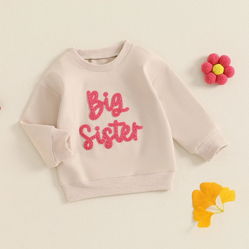 Toddler girls beige long sleeve crewneck pullover top with letter embroidery, loose fit, from August + Willow Baby & Toddler Outfits.