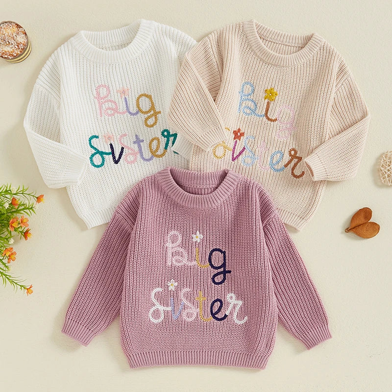 Baby and toddler girls' beige sweater with letter and flower embroidery, crew neck, long sleeves, from August + Willow.