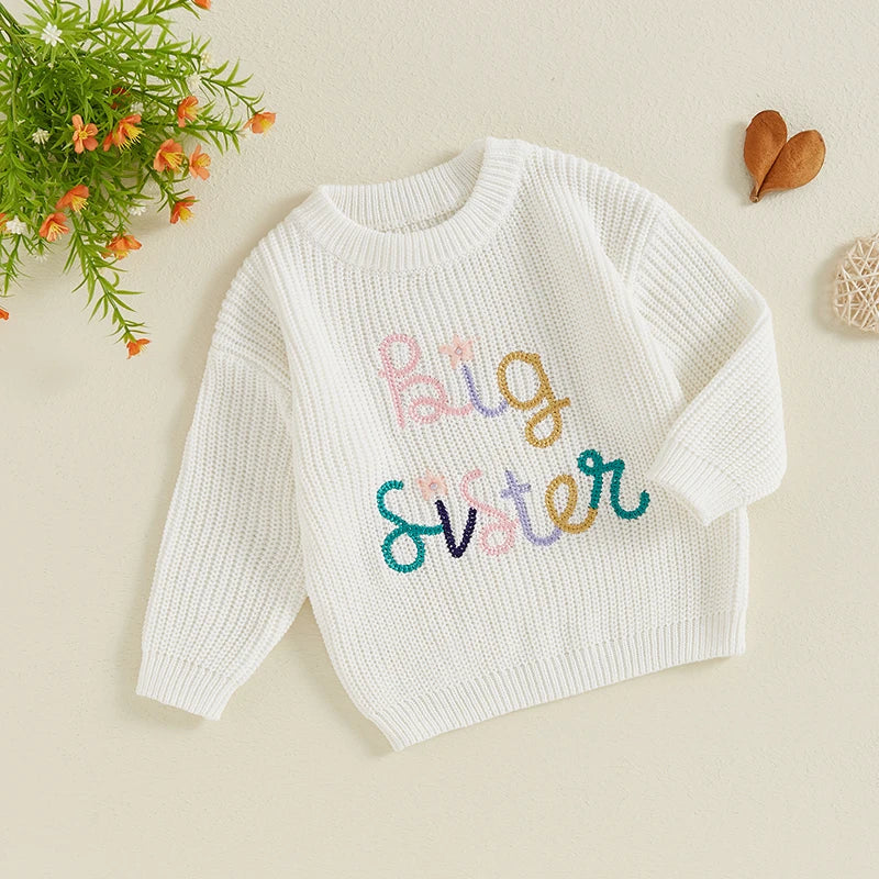 Baby girl fall winter sweater by August + Willow, beige crew neck pullover with letter and flower embroidery for toddlers.