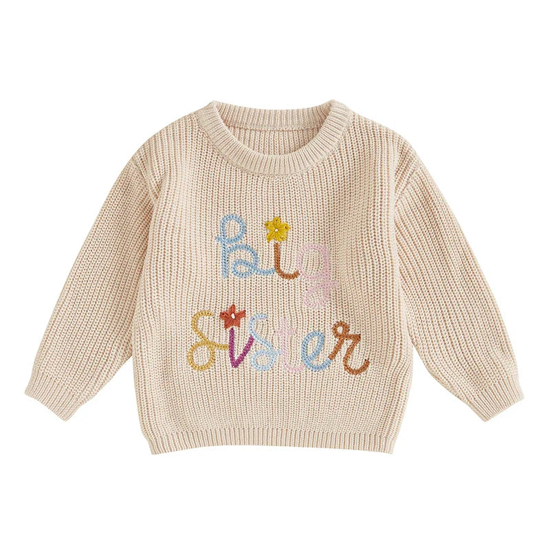 Baby girl Toddler sweater by August + Willow featuring embroidered flowers, letter details, crew neck, long sleeves, perfect for fall and winter.
