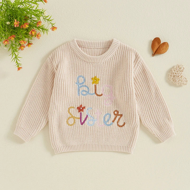 Baby girl toddler sweater by August + Willow with letter and flower embroidery, crew neck, long sleeves, cozy fall winter outfit.