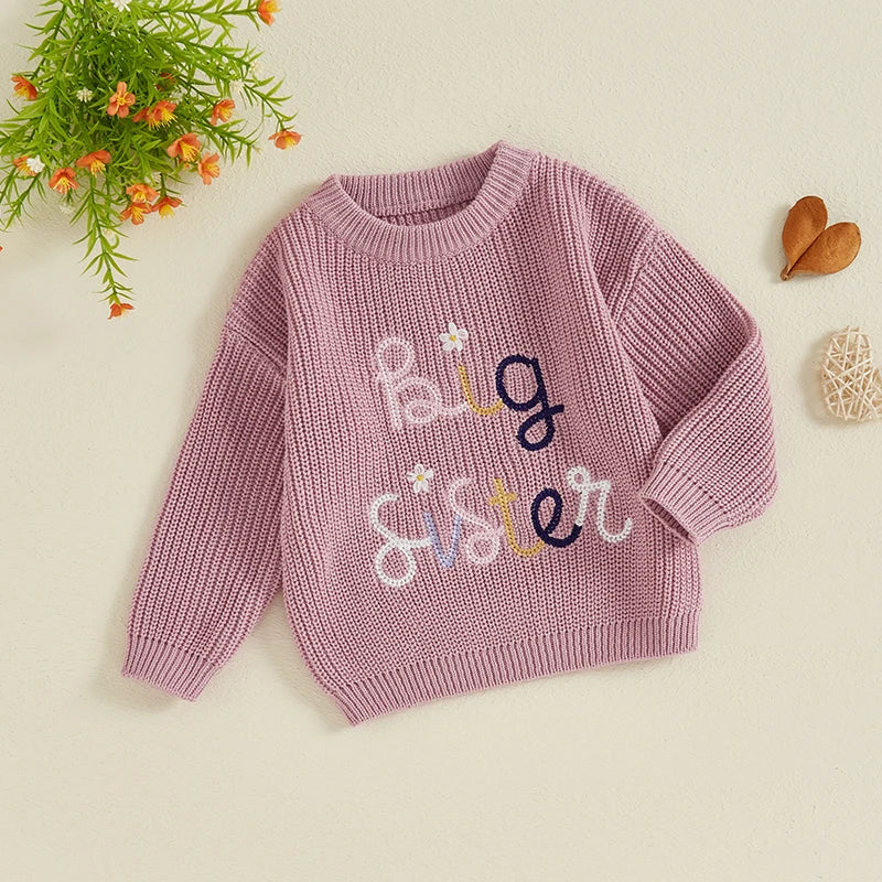 Baby girl toddler sweater by August + Willow featuring floral embroidery, letter details, crew neck, long sleeves, perfect for fall and winter.