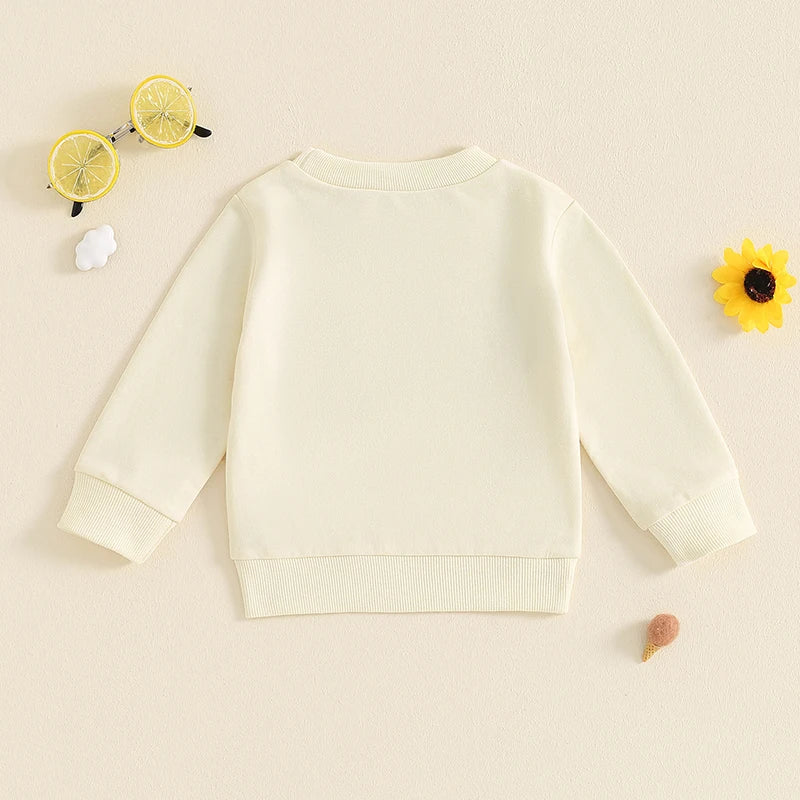Baby girl toddler beige long sleeve pullover top with casual letter print from August + Willow, size 6-12 months.