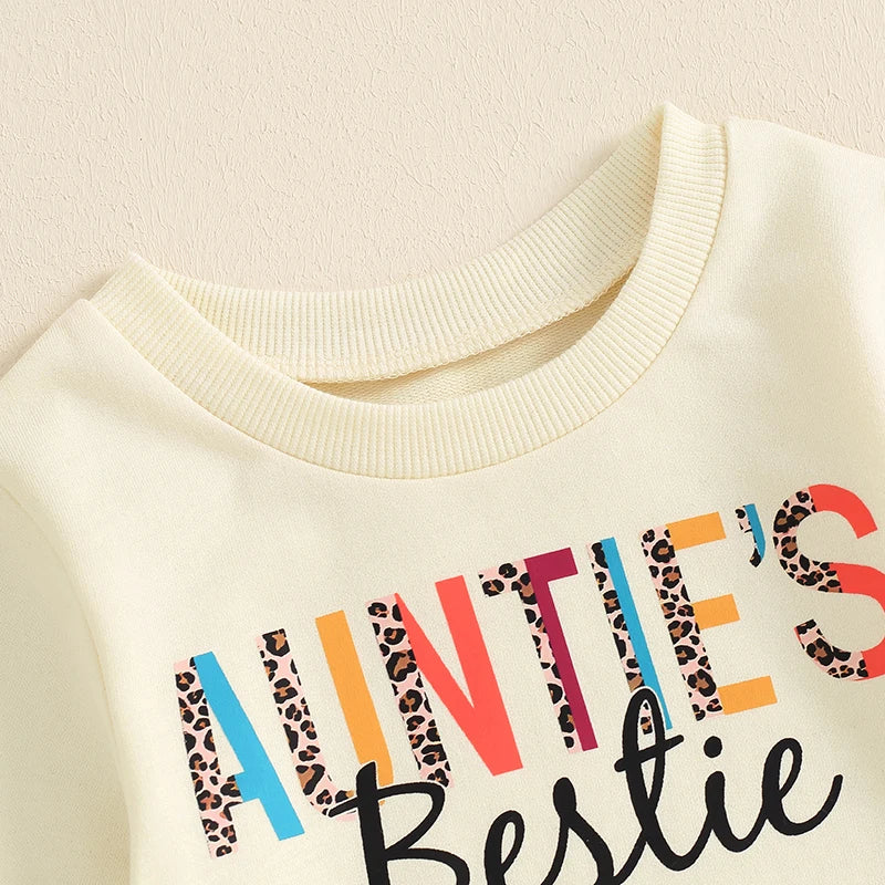 Baby girl toddler long sleeve crew neck pullover top with letter print in beige, from August + Willow, for casual outfits.