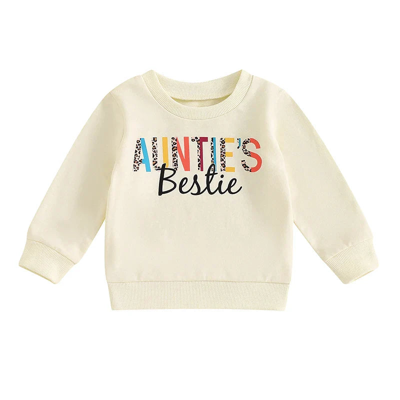 Baby girl toddler pullover top by August + Willow with casual letter print, crew neck, long sleeves, in beige for ages 6-12 months.