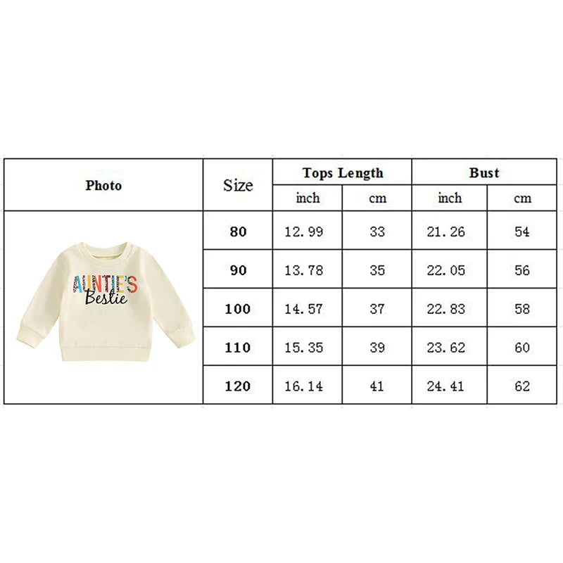 Baby toddler girl wearing beige crew neck long sleeve pullover top with letter print by August + Willow, casual outfit for little girls.