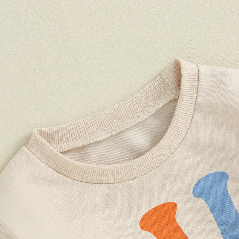 Baby and toddler girls and boys beige matching outfits with letter print "Big Lil Cousin" long sleeve crewneck top by August + Willow.
