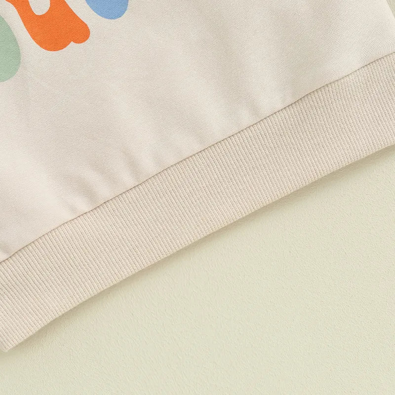 Baby and toddler matching beige crewneck top with letter print, suitable for girls and boys, by August + Willow.