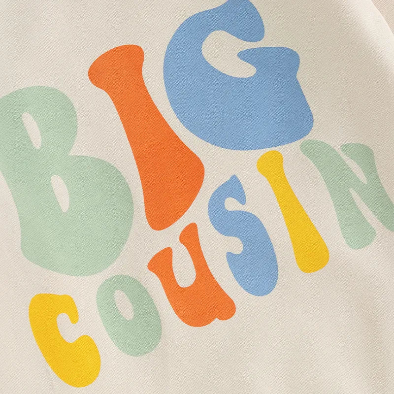 Baby and toddler girls and boys beige matching outfits with letter print Big Lil Cousin long sleeve crewneck top by August + Willow.