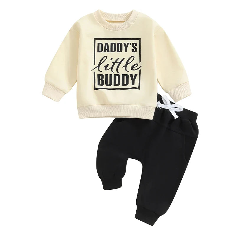 Baby toddler boys 2-piece fall outfit by August + Willow with letter print long sleeve top and solid color pants set.