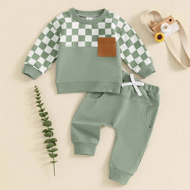 Baby toddler boys fall outfit set by August + Willow with a checkerboard print long sleeve top and solid color long pants.
