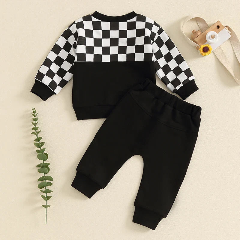 Baby boy fall outfit set with checkerboard long-sleeve top and solid color pants from August + Willow, for ages 6-12 months.