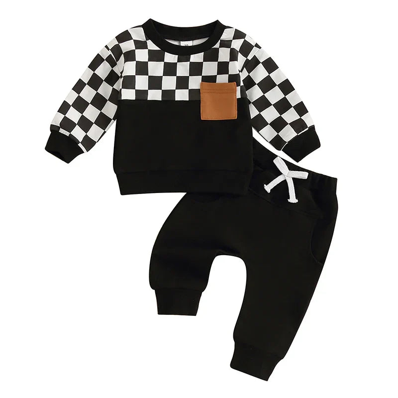 Baby toddler boys fall outfit set with checkerboard print long sleeve top and solid color long pants by August + Willow.