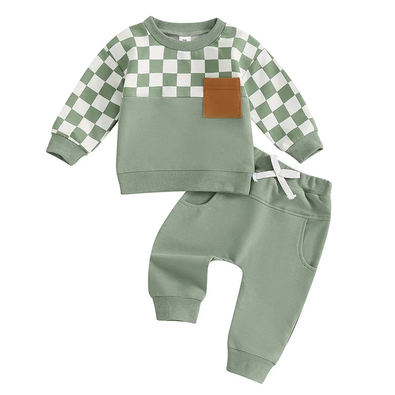Baby boy outfit set with black checkerboard long sleeve top and solid color long pants by August + Willow for toddlers 6-12 months.