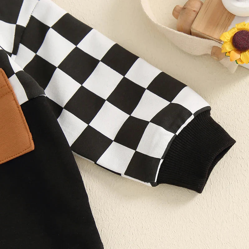 Baby toddler boys fall outfit set with black checkerboard long-sleeve top and solid color long pants, by August + Willow.