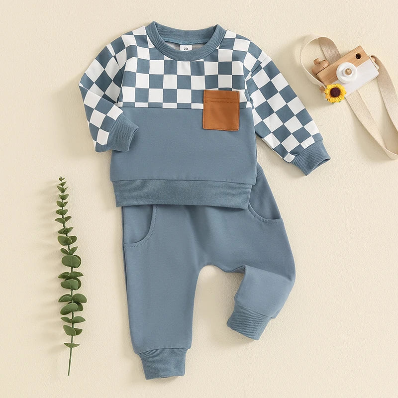 Baby toddler boys fall outfit set with checkerboard print long sleeve top and solid pants by August + Willow, sized 6-12 months.