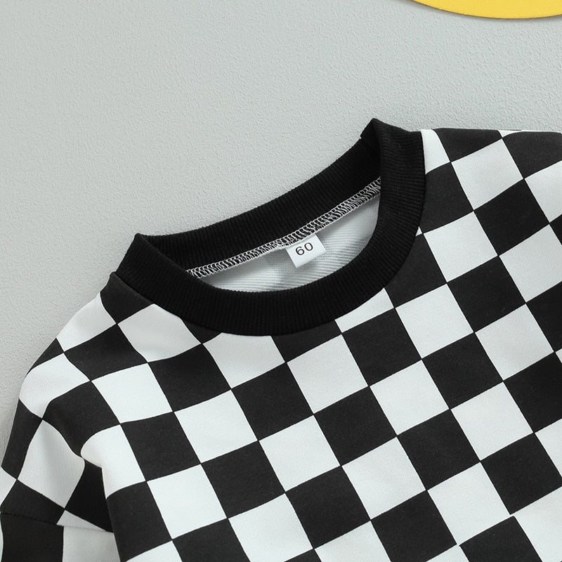 Baby boy or girl fall sweatshirt bodysuit with checkerboard print, long sleeves, suitable for toddlers by August + Willow.