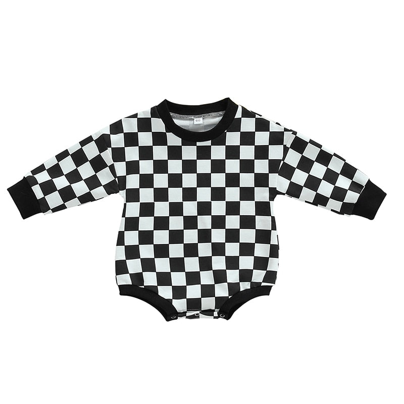 Baby bodysuit by August + Willow featuring a black checkerboard print, long sleeves, and fall-themed design for boys and girls.